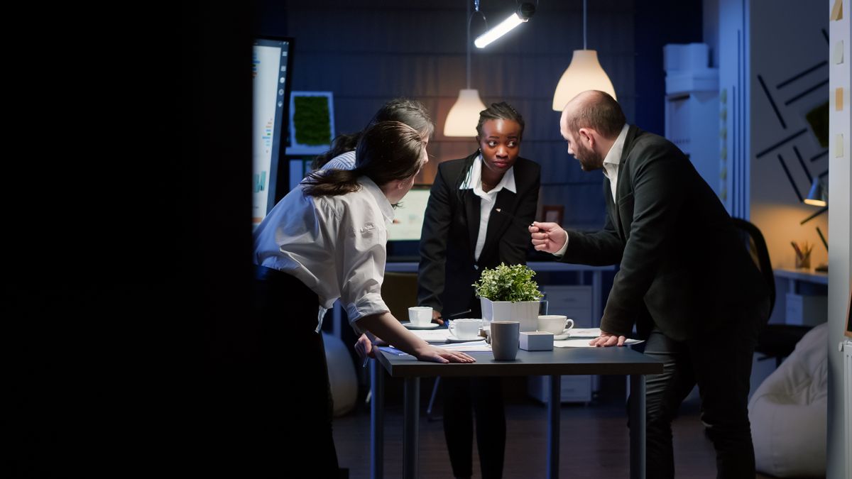 Team discussing marketing strategy around a boardroom table – EP Digital consulting